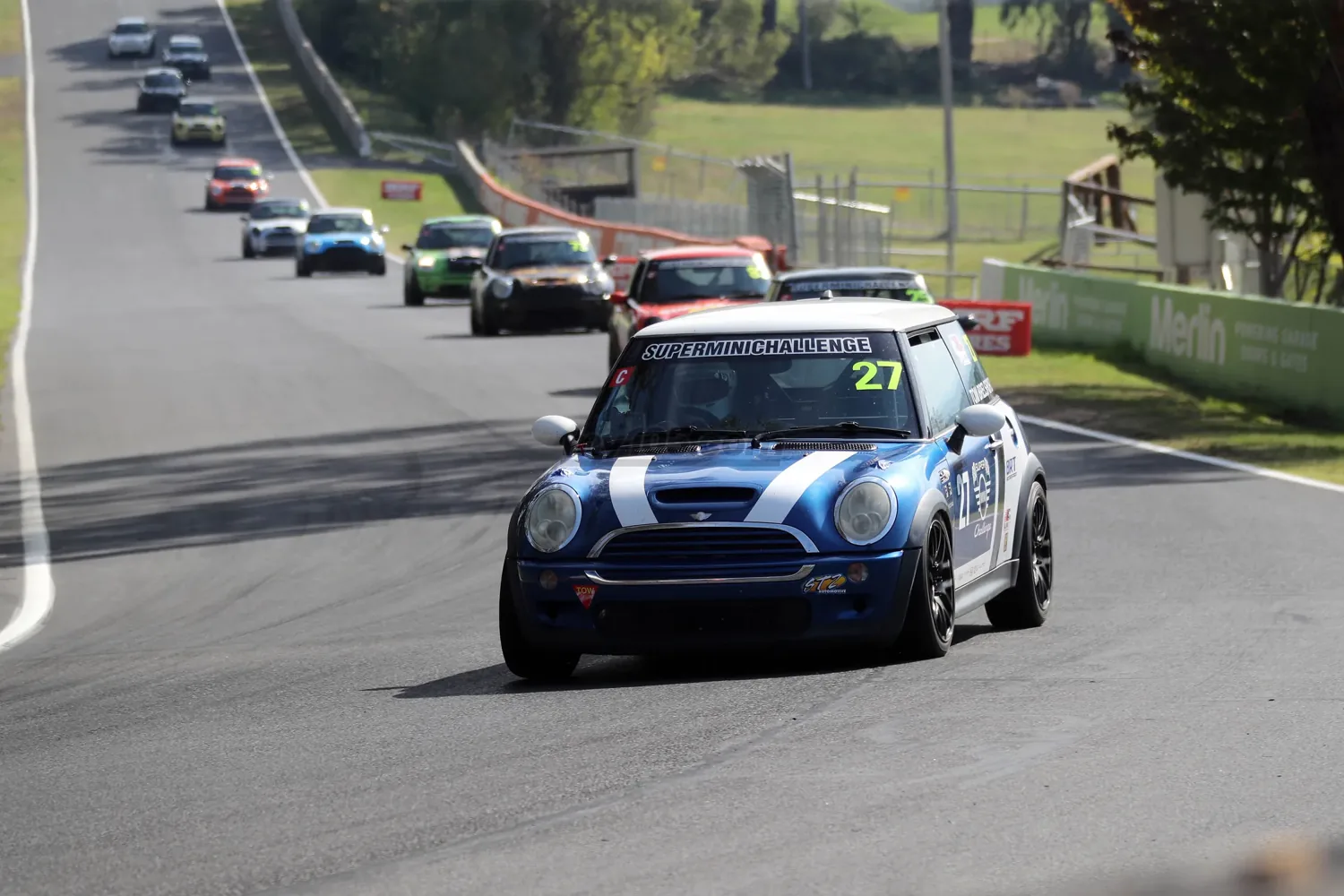 The #27 Cooper Class SuperMini leading a pack of Minis